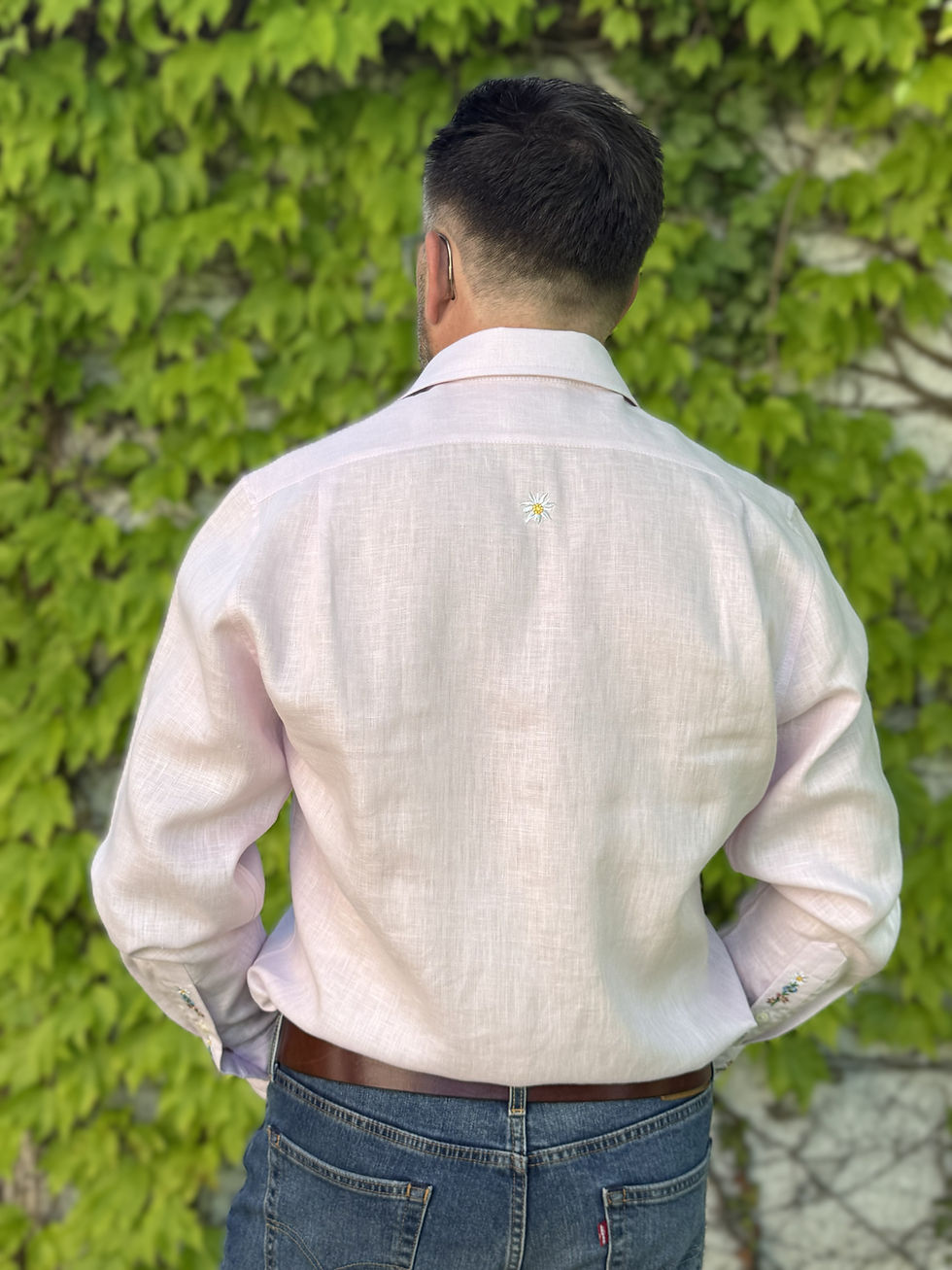 Thumbnail: Man wearing Tarcame Swiss embroidered linen shirt with Alpine flowers embroidery