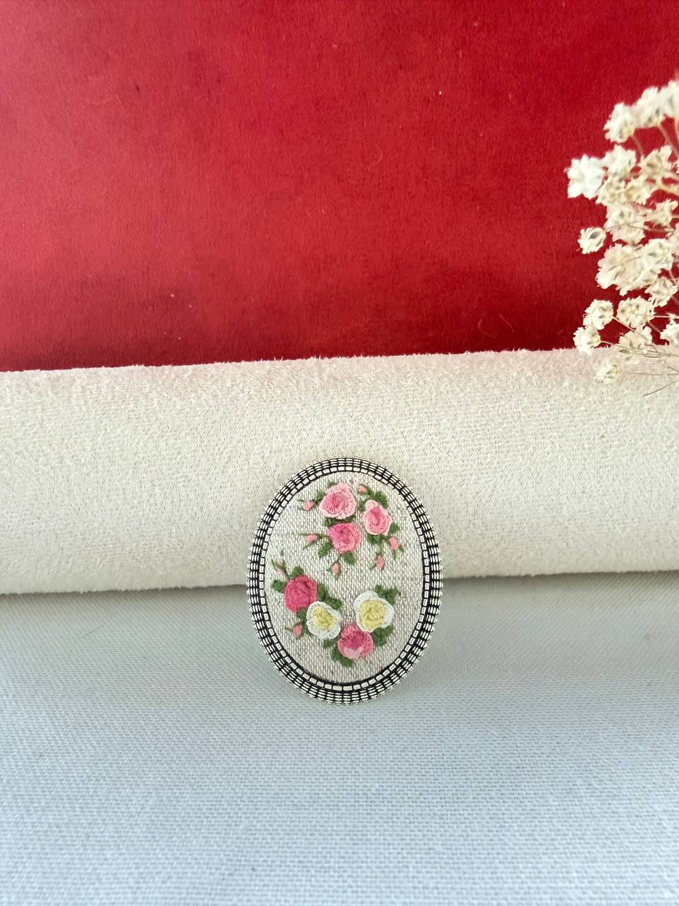 Thumbnail: Hand embroidered pink and white floral brooch on natural linen in a vintage style oval frame