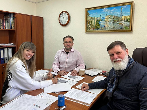 Thomas, Hanna and Yuri signing the first production agreement
