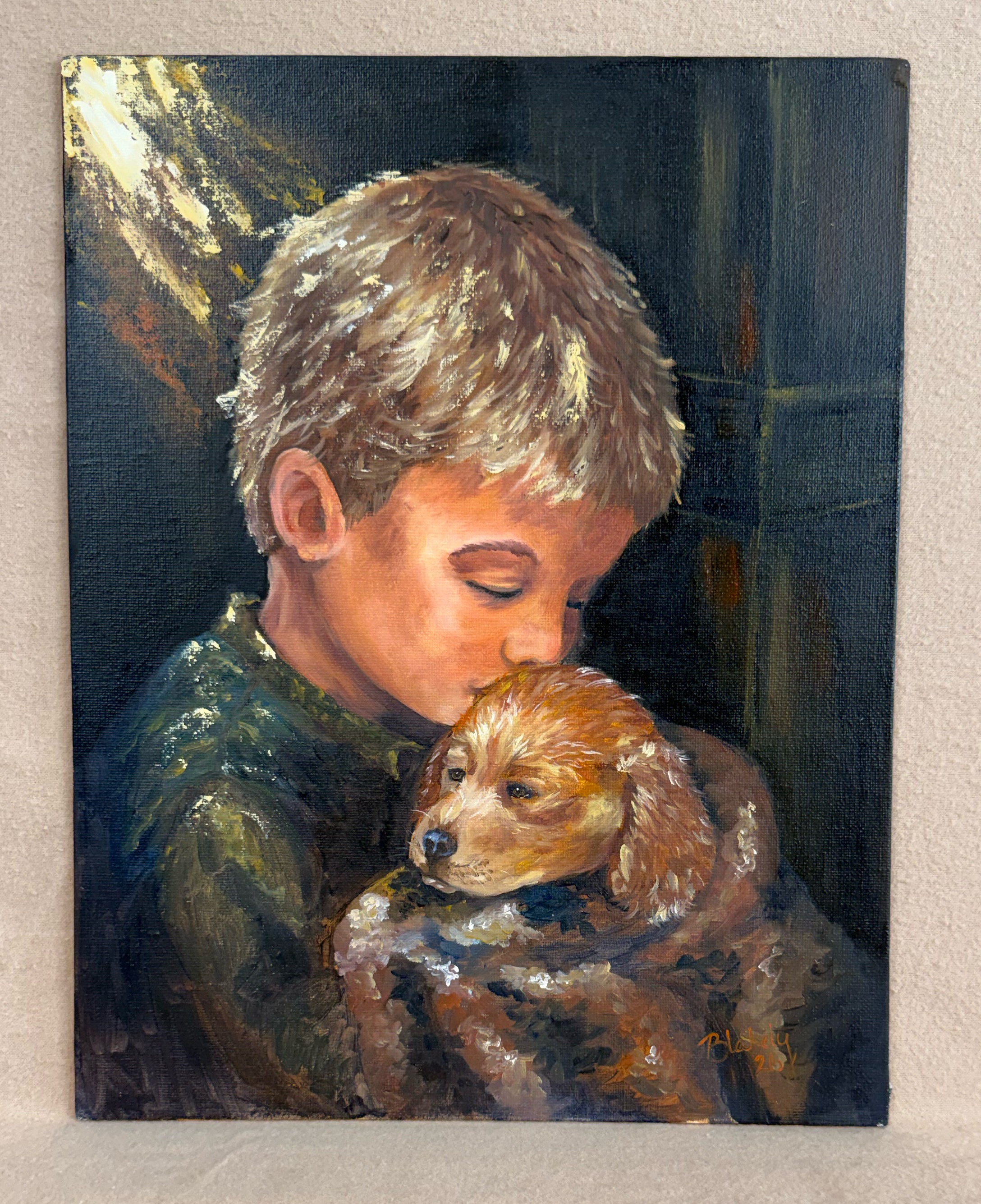 Original oil portrait of a young boy gently kissing a puppy while holding it close, painted by Hope Blakely.