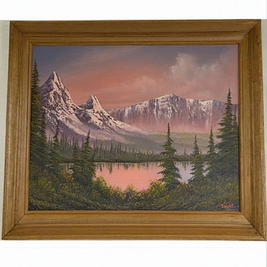 a glowing pink sky behind the mountain