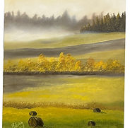 Golden autumn fields and peaceful plains with hazy morning sky, distant forest, and rustic hay bales.