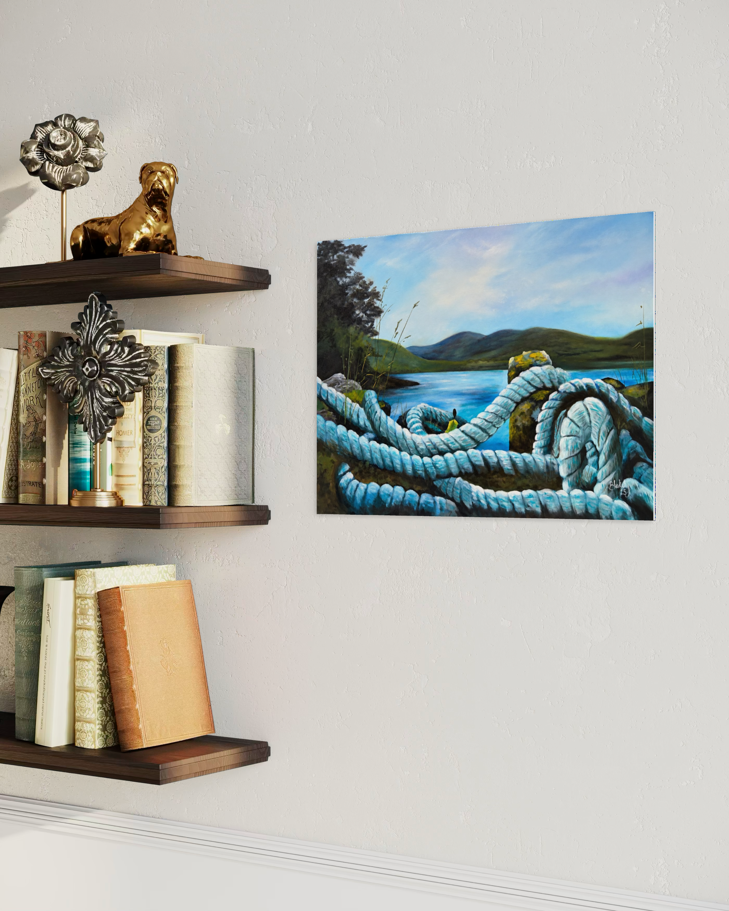 Heart Tethered by the Tide coastal artwork hanging beside wood shelves with books.