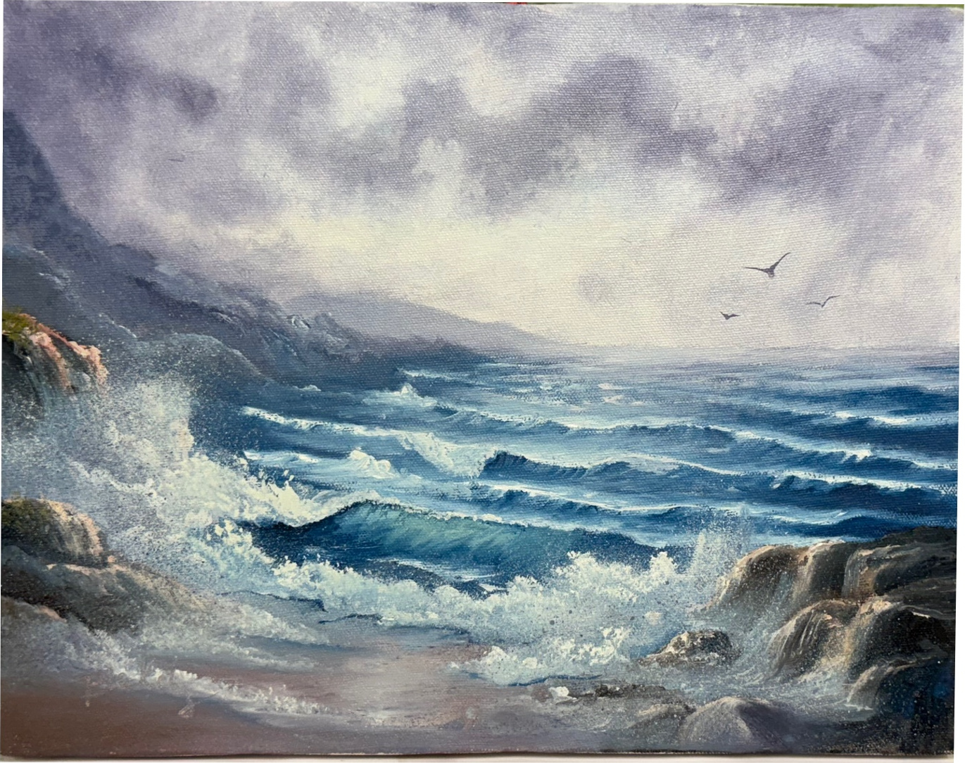 Oil painting of crashing ocean waves on a rocky coastline under a stormy sky, with birds flying in the distance.