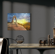 Collector landscape painting with desert arch, golden glow, and deep blue clouds.