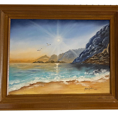 A high sun warming the beach with hills as far as the eye can see.