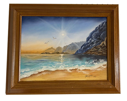 A high sun warming the beach with hills as far as the eye can see.