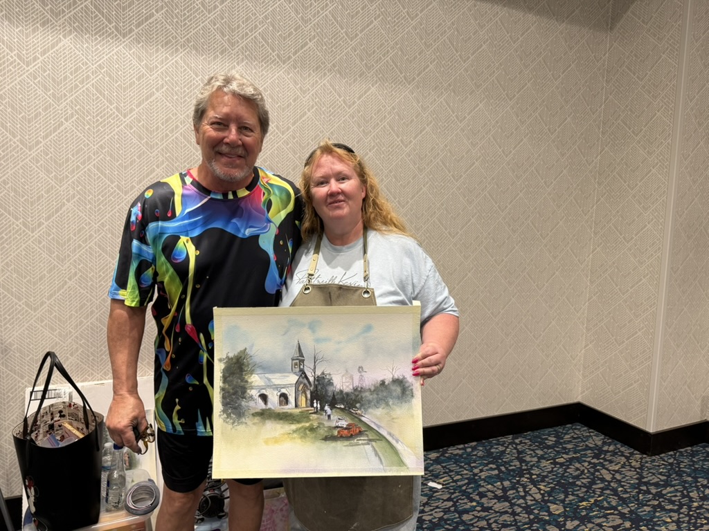 Watercolor painting of a countryside chapel with vintage cars parked in front, painted by Hope Blakely during a Mark Polomchak workshop.