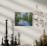 Peaceful English garden scene with willow reflections, pond, and pink flowers.
