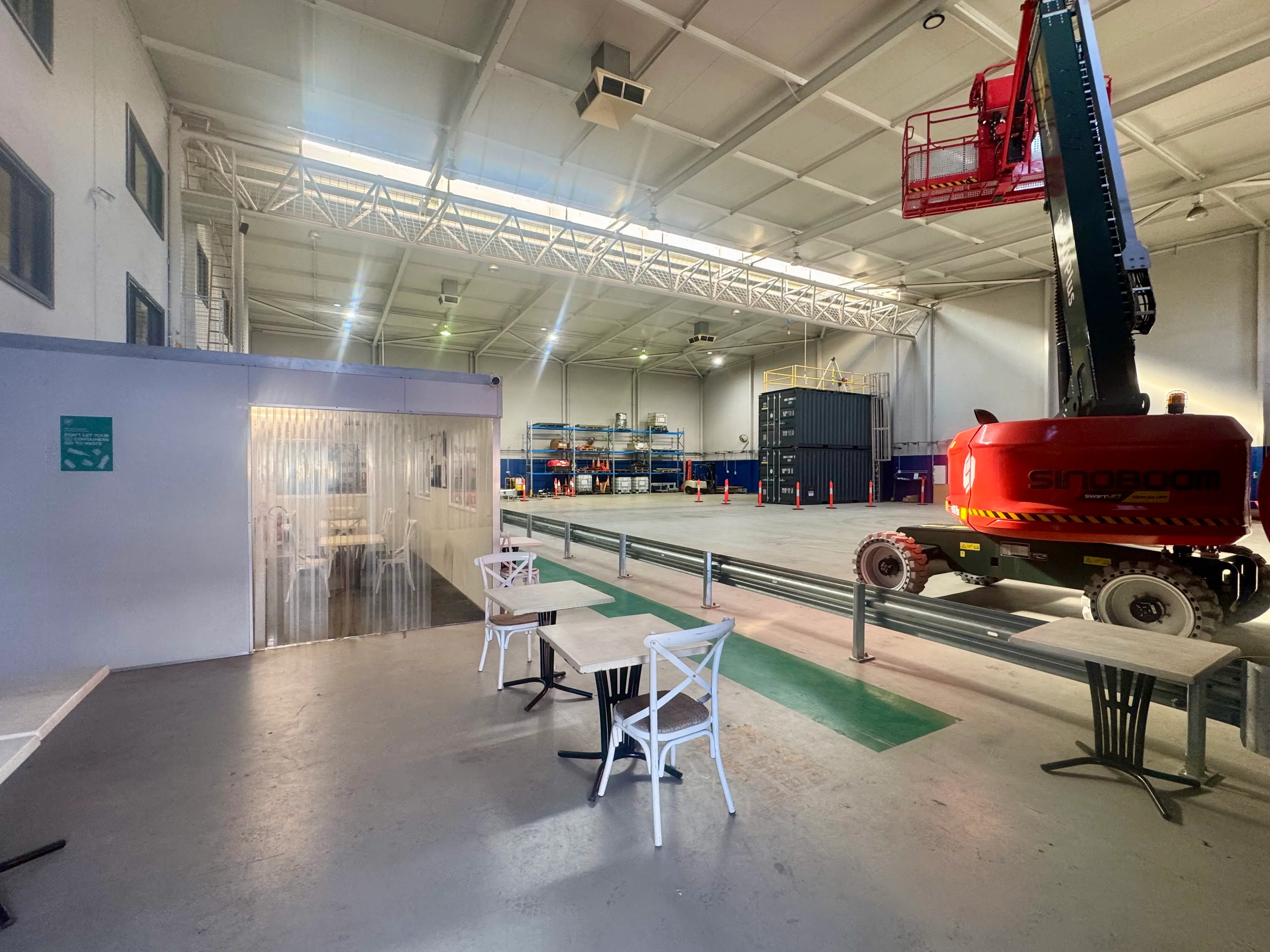 Practical training area at Paratus Training’s Bayswater facility featuring industrial training equipment, EWP machinery and learner breakout space.