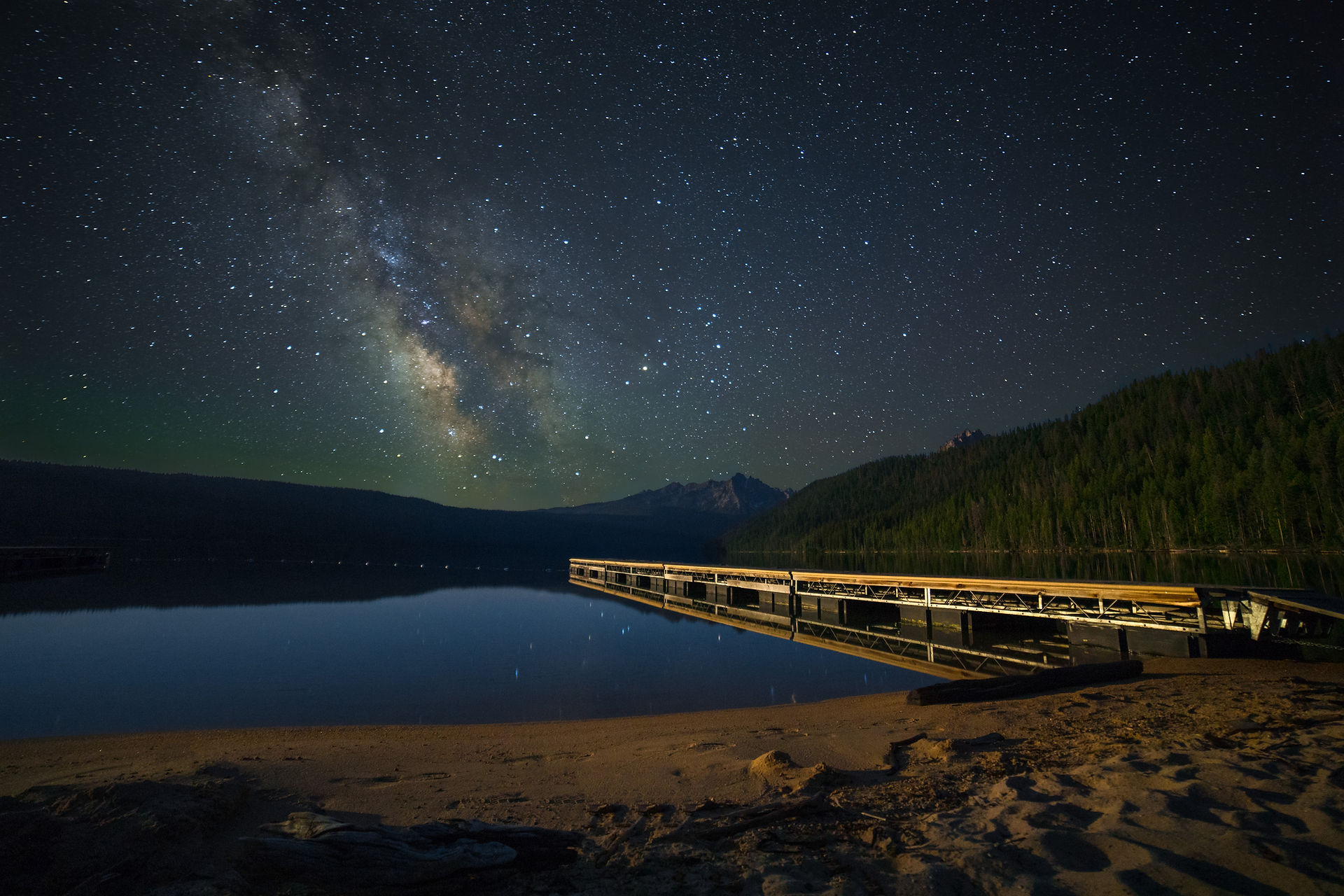 Milkway moving  over Redfish Lake as the full moon rose and lit up the foreground