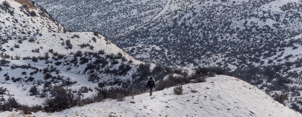 Me hiking in the winter to view the snowy landscape in Lucky Peak