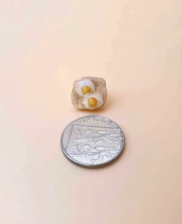 Thumbnail: Toast pin with a 10p coin - size comparison.