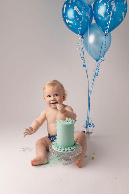 first birthday cake smash photo shoot white and blue themed