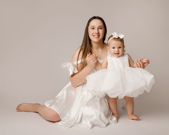 Mother and daughter dressed up for family photo shoot