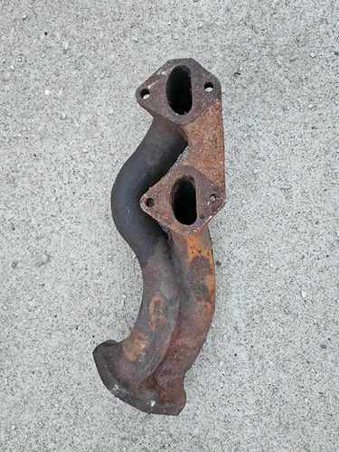 10a mazda factory cast header. | Defined Autoworks