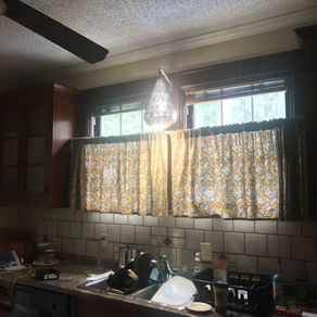 The kitchen is so dark, it stops you from see what you're doing in the kitchen.