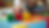 Close-up view of a child’s hands arranging colorful blocks on a play mat