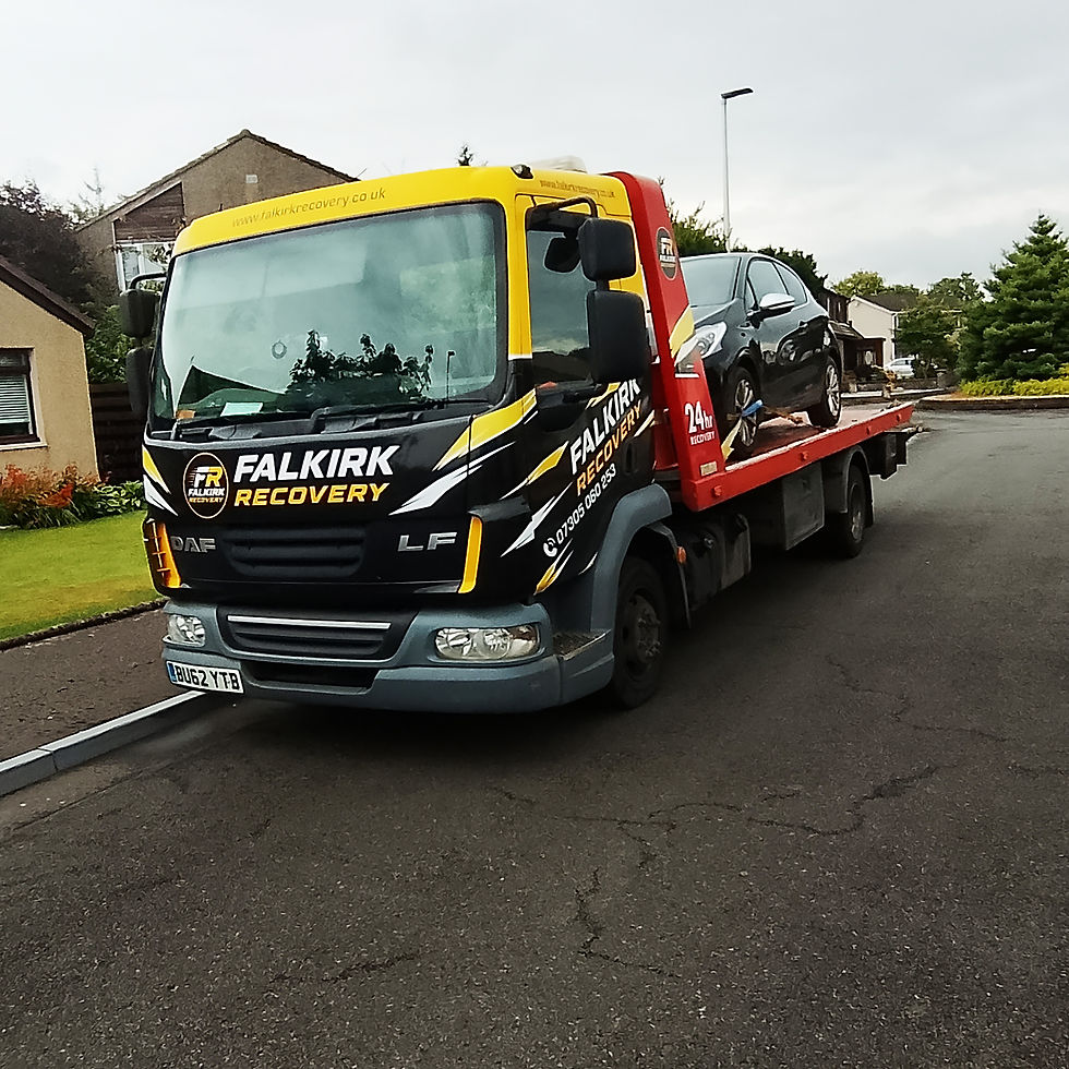 Peugeot 208 loaded onto Falkirk Recovery truck in Grangemouth after the engine management warning light appeared.