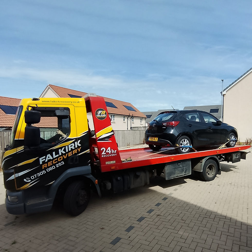 Mazda 2 with no keys loaded for specialist vehicle transport in East Calder
