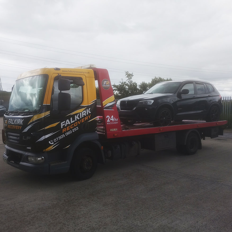 BMW X3 loaded onto recovery truck in Bellshill