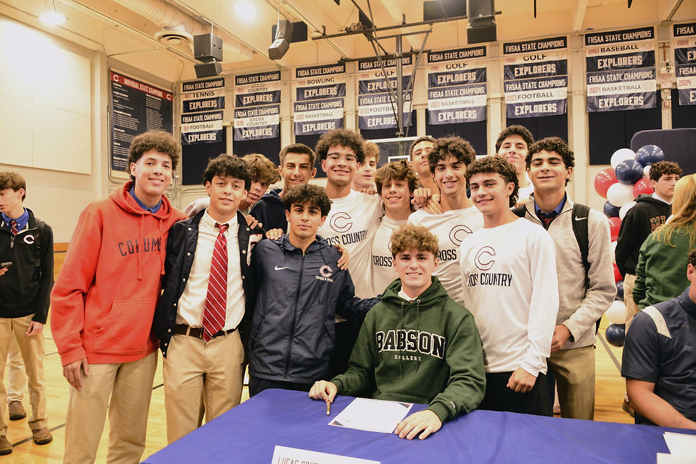 Senior Lucas González surrounded by friends and teammates at Columbus on Class of 2026 National Signing Day during the school day
