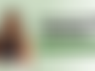 Smiling woman with long hair, arms crossed, on light green background. Text: "Declarative Language: How it supports child development." Total Communication