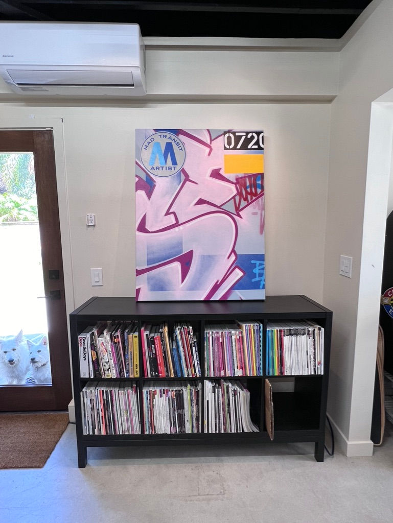 a painting on a wall that says made by an artist