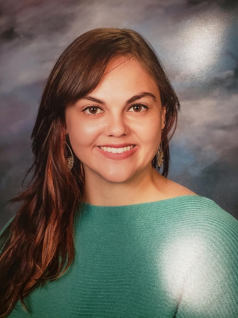 A woman smiling for a portrait