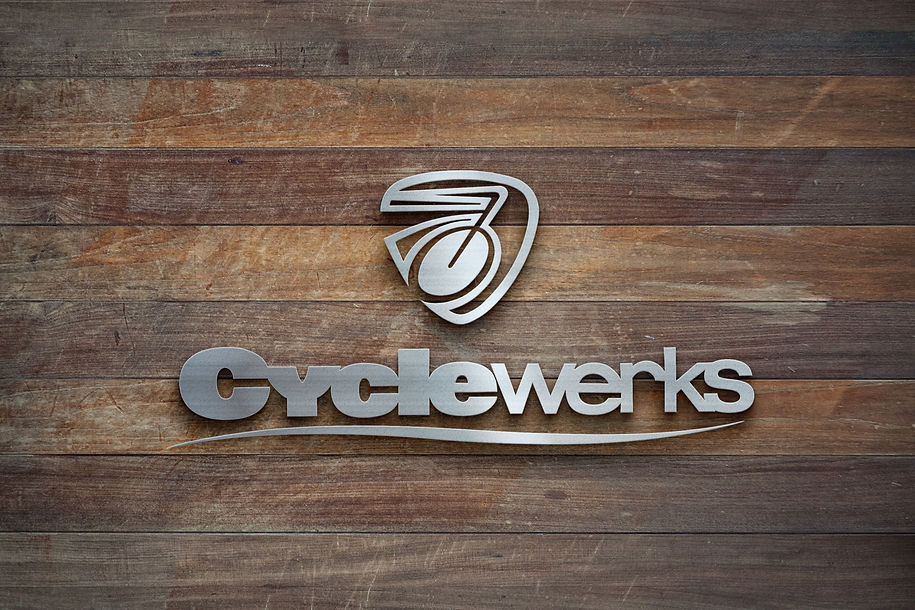 CycleWerks Bicycle & Fitness Metal Logo on wood wall.