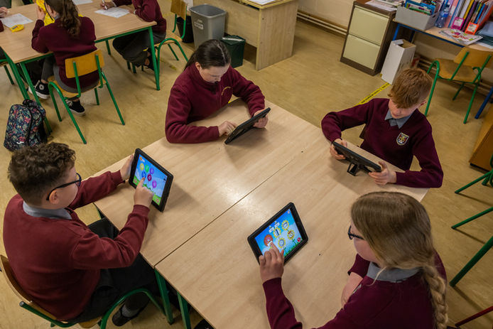 Students using tablets in class to learn Irish (Online Only do NOT Print )