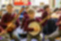 Students playing mandolins and banjos in music class (Online Only do NOT Print )