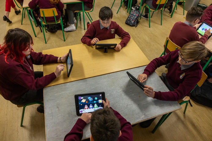 Students using tablets in class to learn Irish (Online Only do NOT Print )