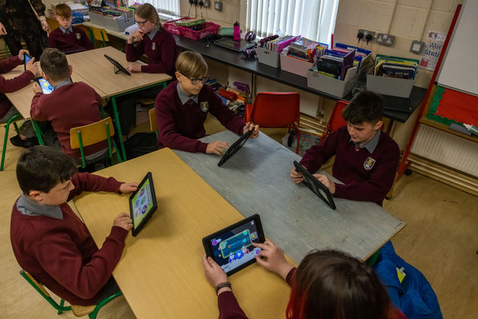 Students using tablets in classroom as part of there Irish lesson (Online Only do NOT Print )