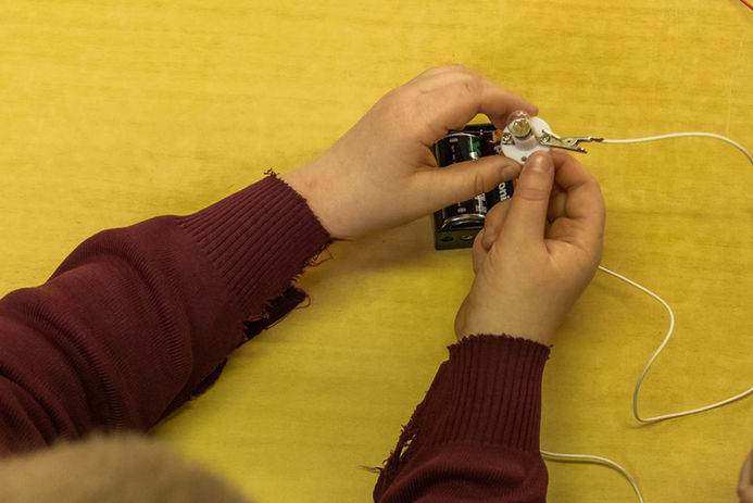 Hands wiring small circuit board  (Online Only do NOT Print )