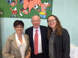 Three people pose for a photo