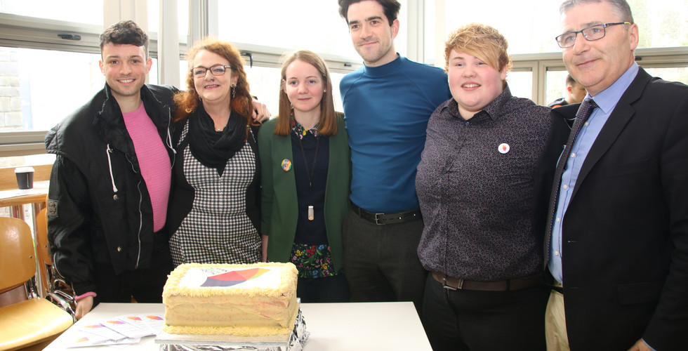 Group celebrating with a cake