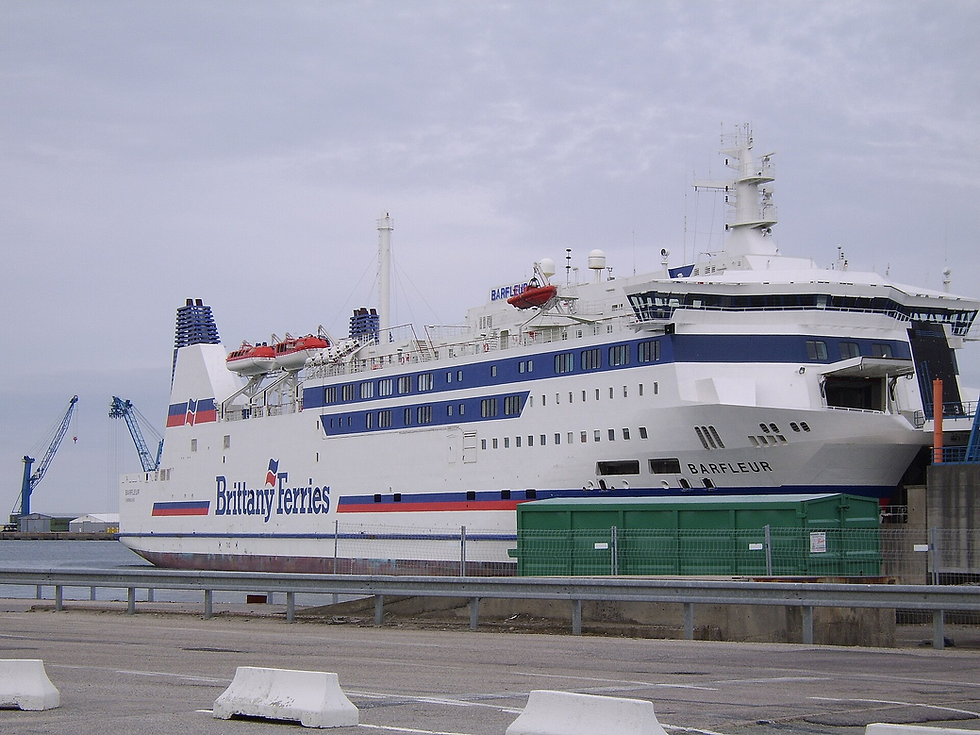 Photo of MS Barfleur from the harbourside at Poole. She's a large ship, primarily white, but with the red and blue Brittany Ferries livery, and with Brittany Ferries painted on her side.