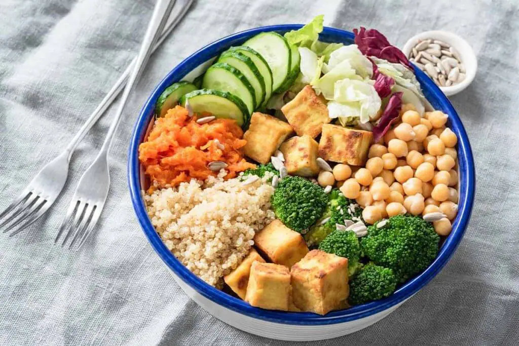 vegan-athlete-diet_veggie-tofu-quinoa-chickpeas-bowl_ft-1024x683.jpg.webp