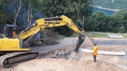you need equipment like this to cut into a mountain - just hit a large rock!