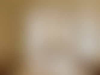 Warm Minimalism Dining Room with Travertine Table, Satin Murano Glass Bowl, Wood chairs, brass chandelier, warm minimalism living room