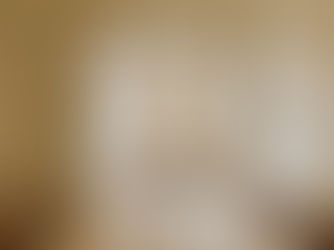 Warm Minimalism Dining Room with Travertine Table, Satin Murano Glass Bowl, Wood chairs, brass chandelier, warm minimalism living room