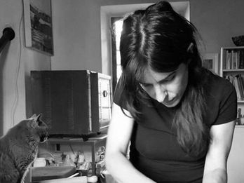 Italian Artisan Dalila works in her studio making a ceramic bowl