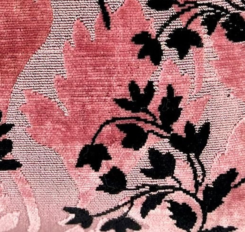 Pink and black Italian jacquard details on the Italian leather handbag. A floral pattern with large pink leaves and small black leaves.