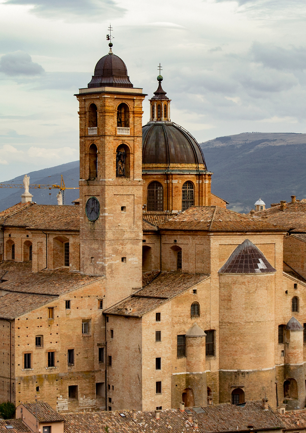 Palazzo Ducale Urbino with cloudy sky and Mountain View.