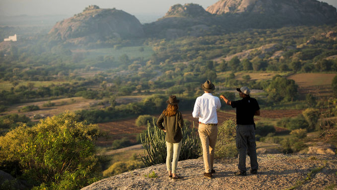 Travellers overlooking the rocky landscape of Jawai, Rajasthan