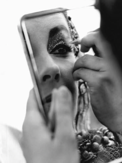 Source: IMDb, photo from Cleopatra (1963). Elizabeth Taylor applying her makeup on the set of Cleopatra