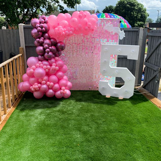 Shimmering sequin glitter wall backdrop reflecting light, perfect for weddings, birthdays, and special events.