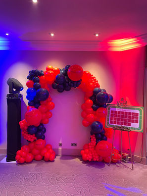 Luxury arched backdrop sailboard with bespoke event styling