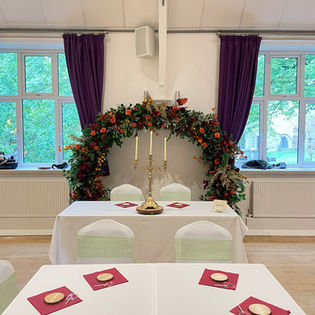 flower arch in autumn colours with table styling